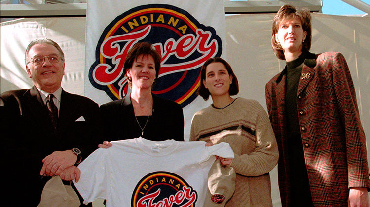 FILE - In this Dec. 17, 1999, file photo, from left, Indiana Pacers President Donnie Walsh, Indiana Fever's Chief Operating Officer Kelly Krauskopf, Fever player Stephanie McCarty, and interim head coach Ann Donovan pose with an Indiana Fever T-shirt in Indianapolis. The Indiana Pacers have hired Kelly Krauskopf as their new assistant general manager, making her the first woman in league history to hold the title. - AP Photo/Tom Strattman, File