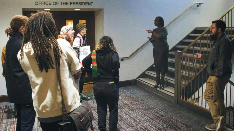 In November, protesters speak with Vice President of Student Affairs Ro-Anne Royer Engle outside the Ball State president's office. - Will Baker / Ball State Daily News