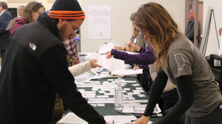 An attendee checks in at the Hoosier Environmental Council's 2017 Greening the Statehouse event. - Lauren Chapman/IPB News