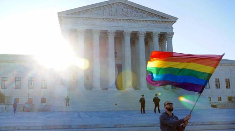 Demonstrators stood outside the United States Supreme Court during arguments in the same-sex marriage case. - Photo byTed Eytan (Flickr)