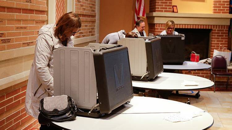 Voters cast ballots on machines in Carmel. - AP Photo/Michael Conroy