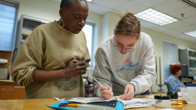 Jacqueline Bell (left), 74, and Sara Hammerle, 23, talk while working on a painting project Thursday, March 7, 2024. - Jenna Watson / Mirror Indy