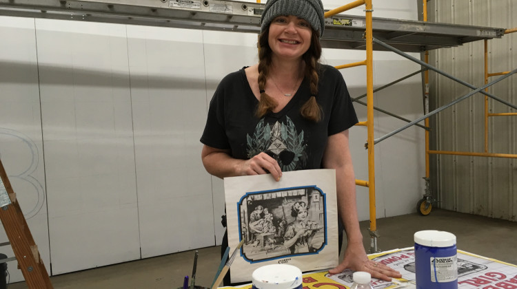 The iconic Clabber Girl Billboard on US-40 just outside of Terre Haute underwent a much-needed restoration in the past year. From WFYIs arts and culture desk, Jill Ditmire spoke with artist Becky Hochhalter about her process as she started the project. - Jill Ditmire/WFYI