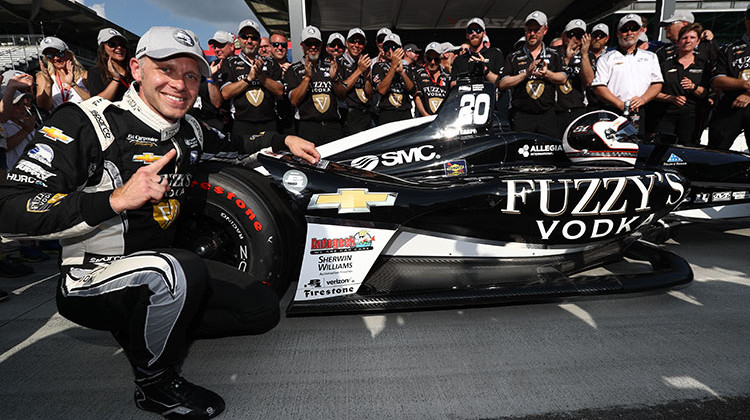 Ed Carpenter with the Verizon P1 Award emblem after winning the pole position for the 102nd Indianapolis 500 at the Indianapolis Motor Speedway. - Photo courtesy of Chris Jones/Indianapolis Motor Speedway