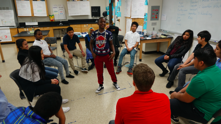 Students in Andy Slater’s science class start the morning by playing a word game. Students jump up to move to an open seat if they agree with what the standing student says – sort of like musical chairs. - Eric Weddle/WFYI Public Media