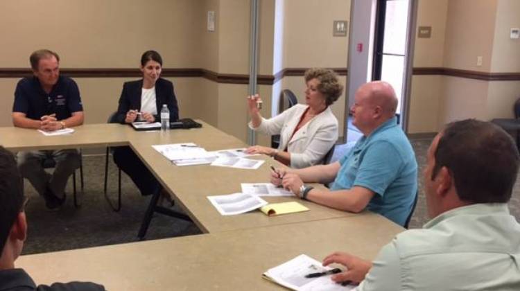 Members of the Hamilton County Health Department and U.S. Congresswoman Susan Brooks check out mosquito larvae.