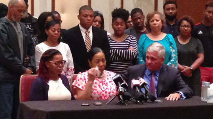 Kyrie Rose (left), and attorney Robert Mongeluzzi (right) comfort Lisa Berry (center) during a press conference in Indianapolis on Tuesday, July 31. - Robert Moscato-Goodpaster/WFYI