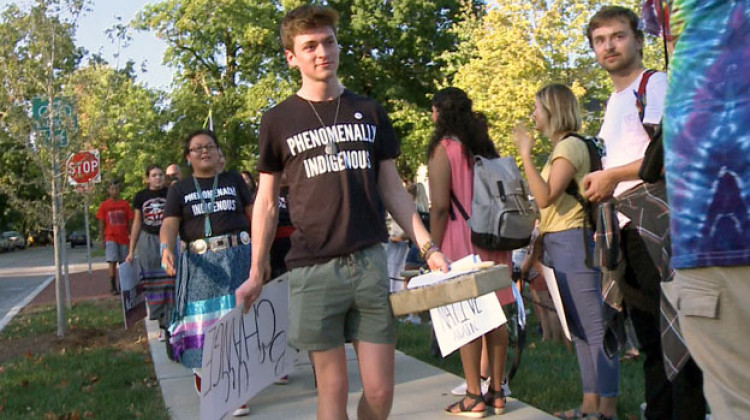 Organizer Caleb King leads the march to the county courthouse. - Joe Hren/WFIU-WTIU News