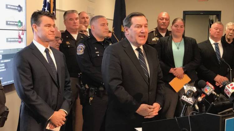 U.S. Senator Joe Donnelly (D-Indiana), center, and Sen. Todd Young (R-Indiana), left, wrote the bill to increase mental health care access for law enforcement officers. - Brandon Smith/IPB