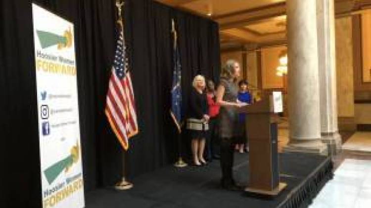 Hoosier Women Forward Board Chair Liane Hulka speaks to a crowd at the Indiana Statehouse.