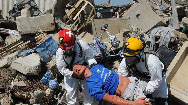 Joint search and extraction team members pull a simulated victim from the rubble during an exercise at the Muscatatuck Urban Training Center at Camp Atterbury, Ind., July 27, 2012. - U.S. Army/SSG Keith Anderson