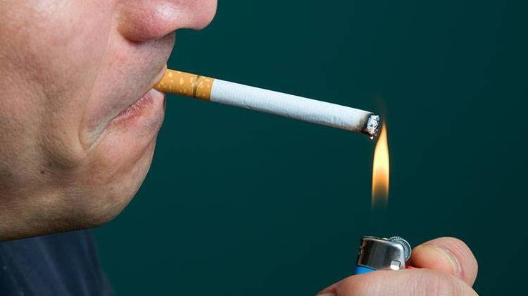 Chicago raised its minimum smoking age to 21.  - stock photo