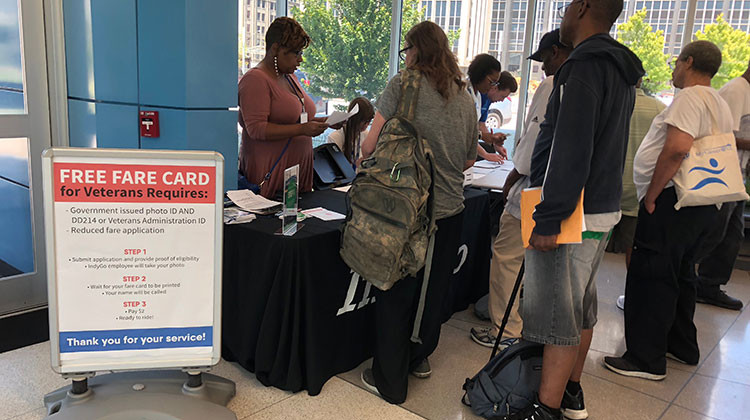 Veterans stand in line to sign up for IndyGos' new fare-free bus pass. The pass entitles veterans to free fare for IndyGo's fixed route. - Sarah Panfil/WFYI