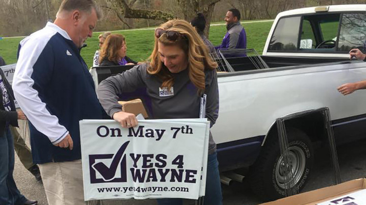 Volunteers distribute signs for Wayne Township Schools ahead of the May 2019 election.  - Yes4Wayne/Facebook