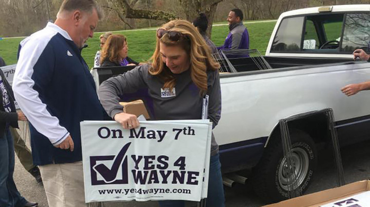 Volunteers distribute signs for Wayne Township Schools ahead of the May 2019 election. - Yes4Wayne/Facebook