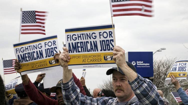 In this file photo Carrier workers and union supporters rally outside the Indianapolis factory Thursday, March 24. - WFYI News file photo