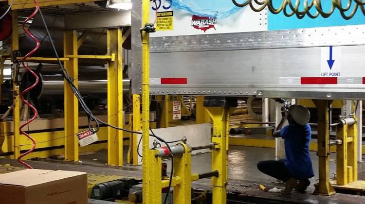 A worker helps assemble a truck trailer at Wabash National's Lafayette factory. - Annie Ropeik/IPB