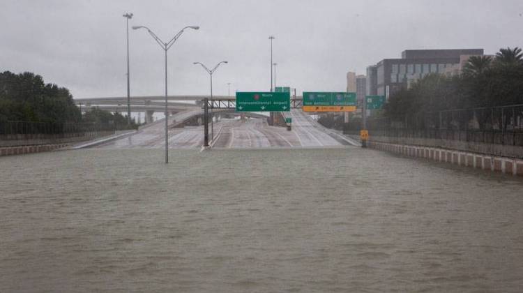 The Sam Houston Tollway is submerged near the Hedwig Village neighborhood in Houston on Tuesday.  - Claire Harbage/NPR