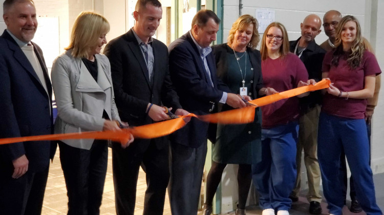 Indiana Department of Corrections and Televerde officials cut a ribbon to celebrate the opening of a new call center at Madison Correctional Facility. - Samantha Horton/IPB News