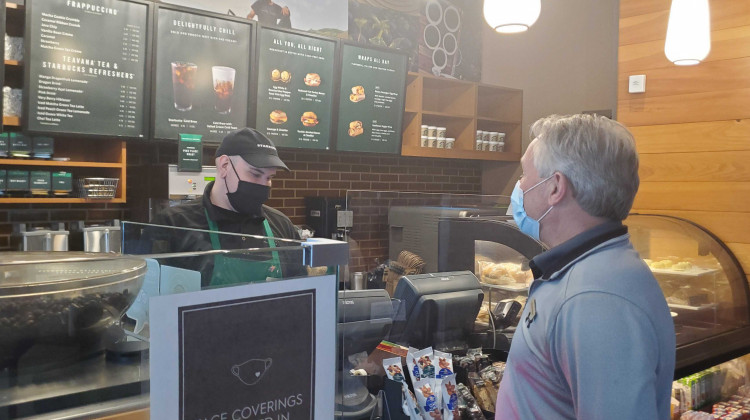 Michael Moros, Indianapolis Marriott Downtown general manager, gets a coffee from the hotel's Starbucks. - Samantha Horton/IPB News