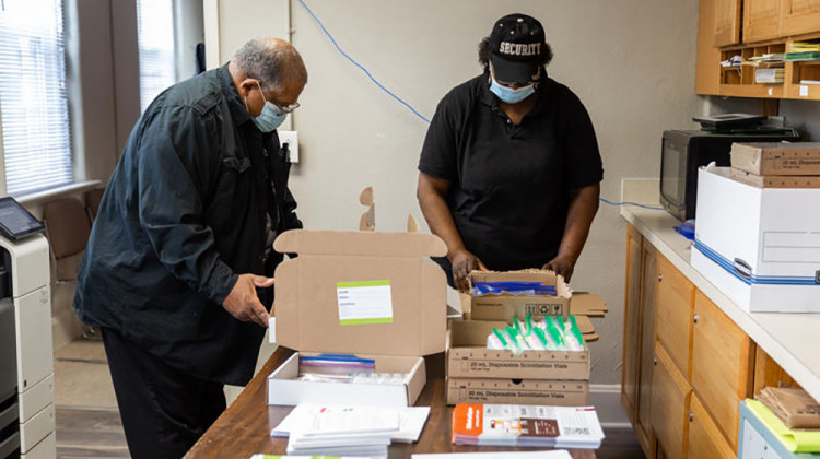 George Armstrong and Stephanie Patterson put together lead test kits at First Baptist Church North Indianapolis.  - Liz Kaye/Indiana University