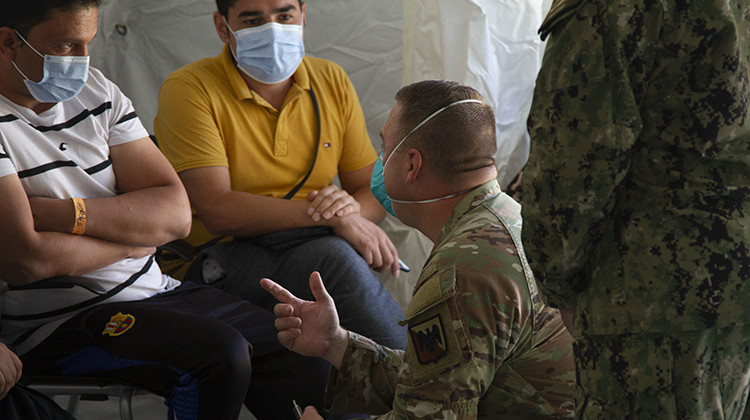Indiana National Guard Sgt. 1st Class Joseph Stringer interprets for Afghan guests during medical screening, Friday, Sept. 10, 2021, at Camp Atterbury in Indiana.  - U.S. Army/Sgt. Dylan Bailey