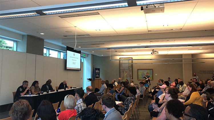 A panel of experts which included IMPD Chief Bryan Roach and Director of Community Violence Reduction Shonna Majors spoke to dozens at Thursday's public safety forum on violence reduction in Indianapolis. - Sarah Panfil/WFYI