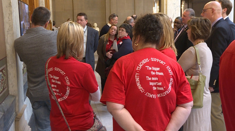 Teachers dressed in red joined other education advocates at a school funding meeting in the statehouse.  - Jeanie Lindsay/IPB News