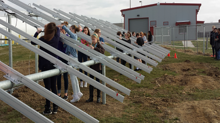 Students build racking for 950 solar panels at the Lake Prairie Elementary School array. - Tri-Creek School Corporation