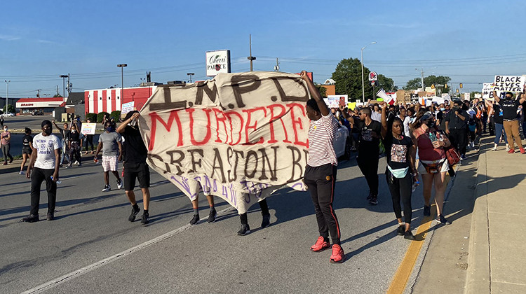 Protesters marched along 38th Street Friday night to  - Darian Benson/Side Effects Public Media