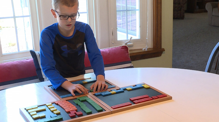 Grant Hartley works with his mom before school every day to improve his reading skills through a special tutoring program. - Jeanie Lindsay/IPB News