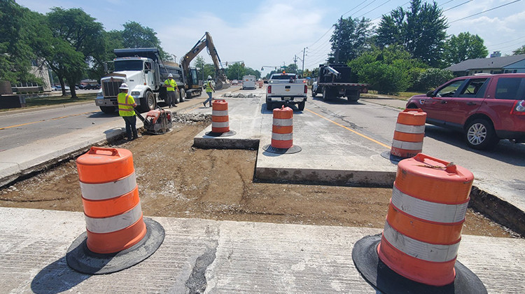 Crews work to patch a section of 56th Street in July. - Courtesy Indianapolis Department of Public Works