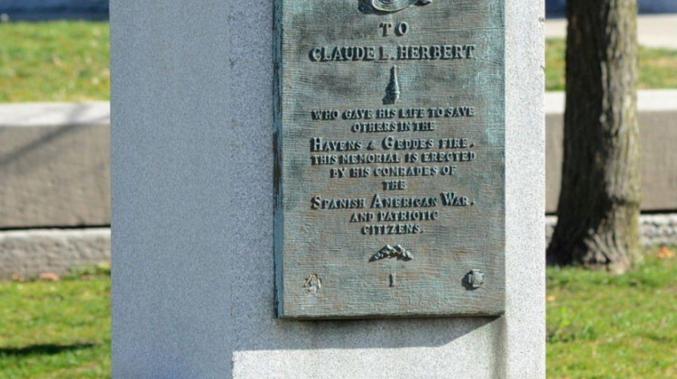 This undated photograph shows a monument in Terre Haute, Ind., to Claude Herbert, a young soldier who died in December 1898 after rescuing children and workers from a fire at a Terre Haute department store where he was portraying Santa Claus. Terre Haute Mayor Duke Bennett said the granite monument will be moved next spring from its longtime location near city hall to the former site of the Havens & Geddes department store.  - (The Tribune-Star via AP)