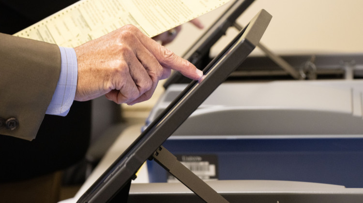 Vanderburgh County Election Board members execute a mock election Thursday, Sept, 29. The votes are entered via touch screen. The machine then prints a small paper ballot to be tabulated. - Tim Jagielo / WNIN