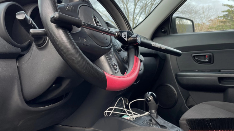 A Kia Sol is rendered immobile with a steering wheel lock due to its vulnerability to theft. - Rebecca Green
/
WBOI News