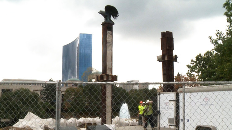 Workers at the 9/11 memorial in Indianapolis on Aug. 18, 2021. - Adam Pinsker/WFIU-WTIU