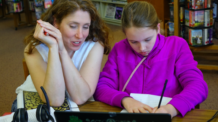 Anna Allman with daughter Piper as they review German language words as part of Piperâ€™s Hoosier Virtual Academy foreign language course. - Eric Weddle/WFYI