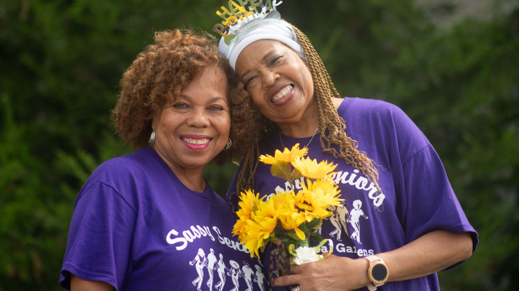 Amanda Oliver (left) and Gladys Tandy pose for a photo after a line dancing class in September. The two women have known each other for three years. They were connected through a hospital program for patients who are at risk for loneliness and social isolation. - Alex Li / Side Effects Public Media