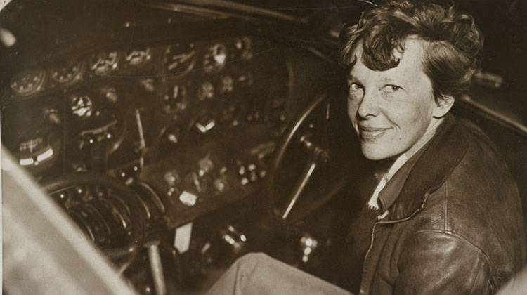 Amelia Earhart sitting in the cockpit of an Electra airplane in 1937. - Library of Congress