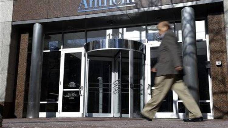 A man walks past health insurer Anthem's corporate headquarters in Indianapolis, Thursday, Feb. 5, 2015. Hackers broke into the company's database storing information for about 80 million people in an attack bound to stoke fears many Americans have about the privacy of their most sensitive information - The Associated Press