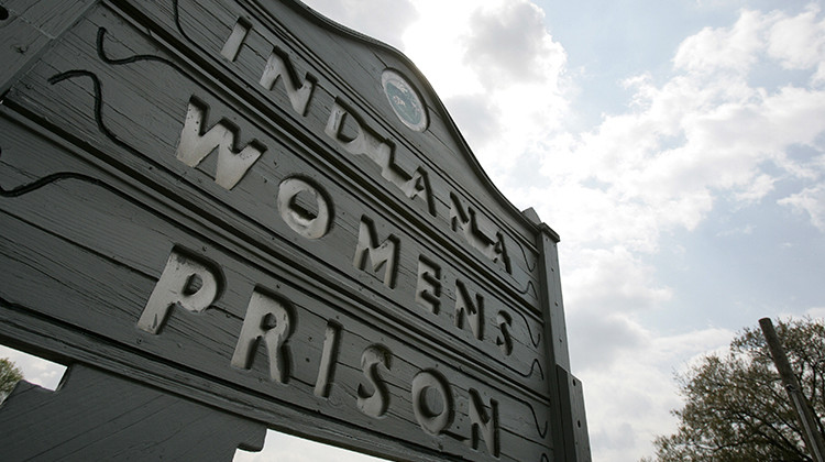 A sign marks the entrance to the Indiana Women's Prison in Indianapolis. - AP Photo/Michael Conroy
