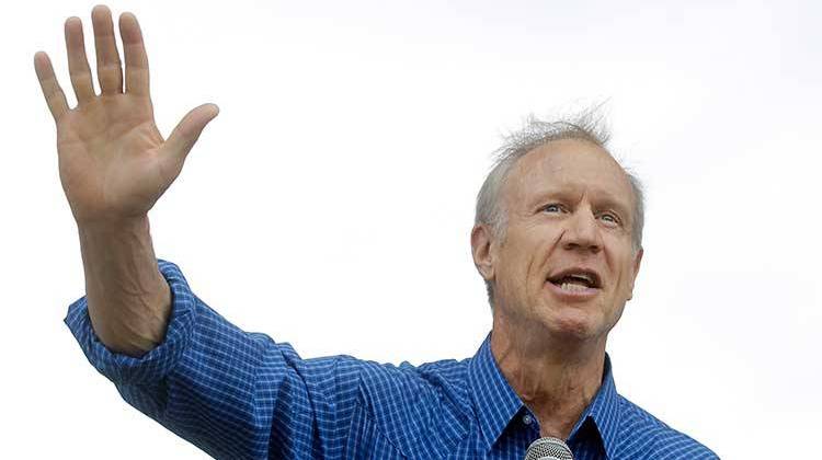 Illinois Gov. Bruce Rauner, shown here at the Illinois State Fair, will sign a bill to stiffen penalties for trafficking guns into Illinois. - AP Photo/Seth Perlman