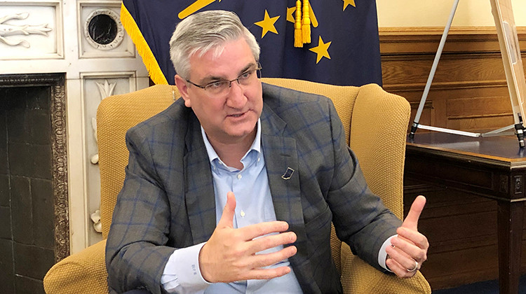 Indiana Gov. Eric Holcomb speaks with reporters about the state's coronavirus response on Friday, March 13, 2020, at his Statehouse office in Indianapolis. - AP Photo/Tom Davies