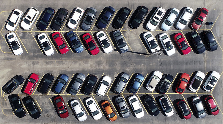 Cars are parked in an auto dealer lot . U.S. retail sales recorded a record drop in March, with auto sales down 25.6%, as the coronavirus outbreak closed down thousands of stores and shoppers stayed home. - AP Photo/Jeff Roberson
