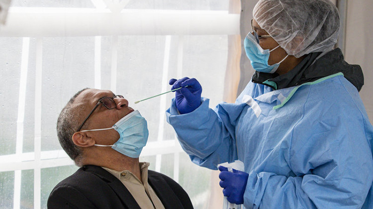 Indiana gubernatorial candidate Dr. Woody Myers takes a COVID-19 test at Aria Diagnostics in Indianapolis last week. - Michael Conroy/AP