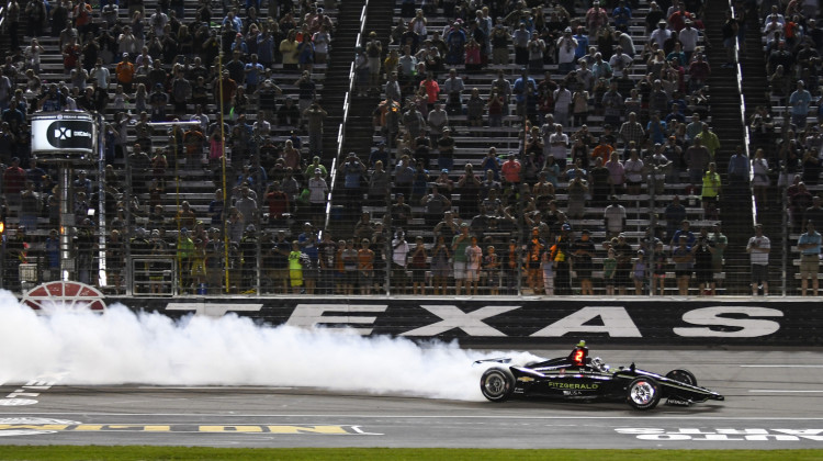 FILE - In this June 8, 2019, file photo, Josef Newgarden celebrates winning the IndyCar auto race at Texas Motor Speedway in Fort Worth, Texas. IndyCar has gotten the green flag to finally start its season in Texas. The race will be run June 6 without spectators at Texas Motor Speedway. - AP Photo/Randy Holt, File