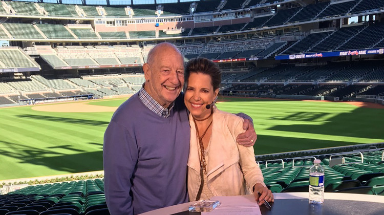 In this March 2017 photo provided by Hannah Storm, Mike Storen poses with daughter Hannah Storm at the Atlanta Braves' new ballpark in Atlanta. Storen, a former ABA commissioner and multisport marketing whiz, died Thursday, May 7, 2020. He was 84. Storm said her father died at Emory University Hospital in Atlanta of complications from cancer. - Courtesy of Hannah Storm via AP
