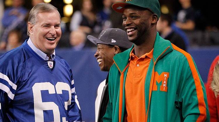 Indianapolis Mayor Greg Ballard, left, talks with former Indianapolis Colts receiver Reggie Wayne before an NFL football game in Indianapolis, Sunday, Nov. 29, 2015. - AP Photo/AJ Mast