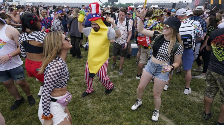 Race fans dance in the Snake Pit before the Indianapolis 500 auto race at Indianapolis Motor Speedway, Sunday, May 28, 2023, in Indianapolis.  - Darron Cummings / AP Photo/