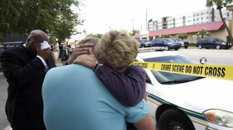 Terry DeCarlo, executive director of the LGBT Center of Central Florida, center, is comforted by Orlando City Commissioner Patty Sheehan, right, after a shooting involving multiple fatalities at a nightclub in Orlando, Fla., Sunday, June 12, 2016. - AP Photo/Phelan M. Ebenhack